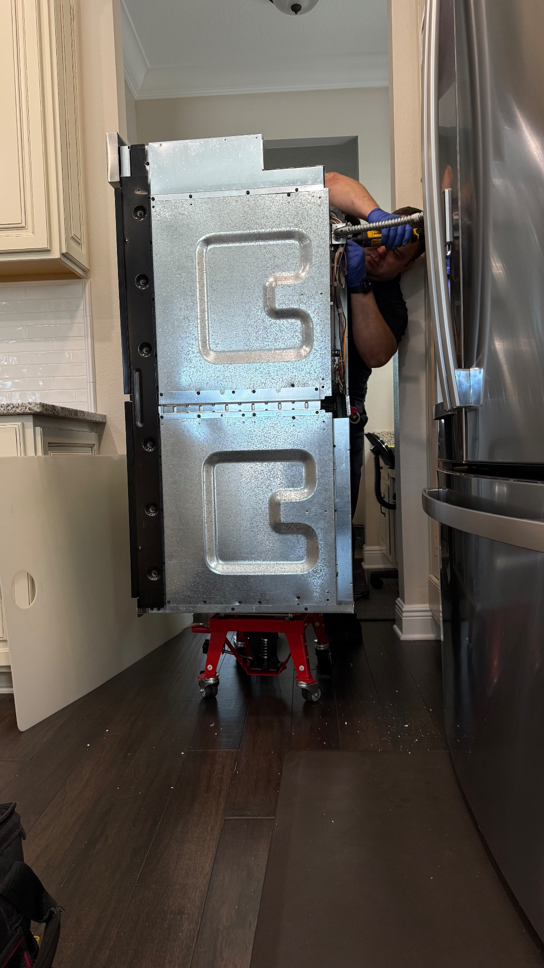 Accessing the rear of a built-in oven