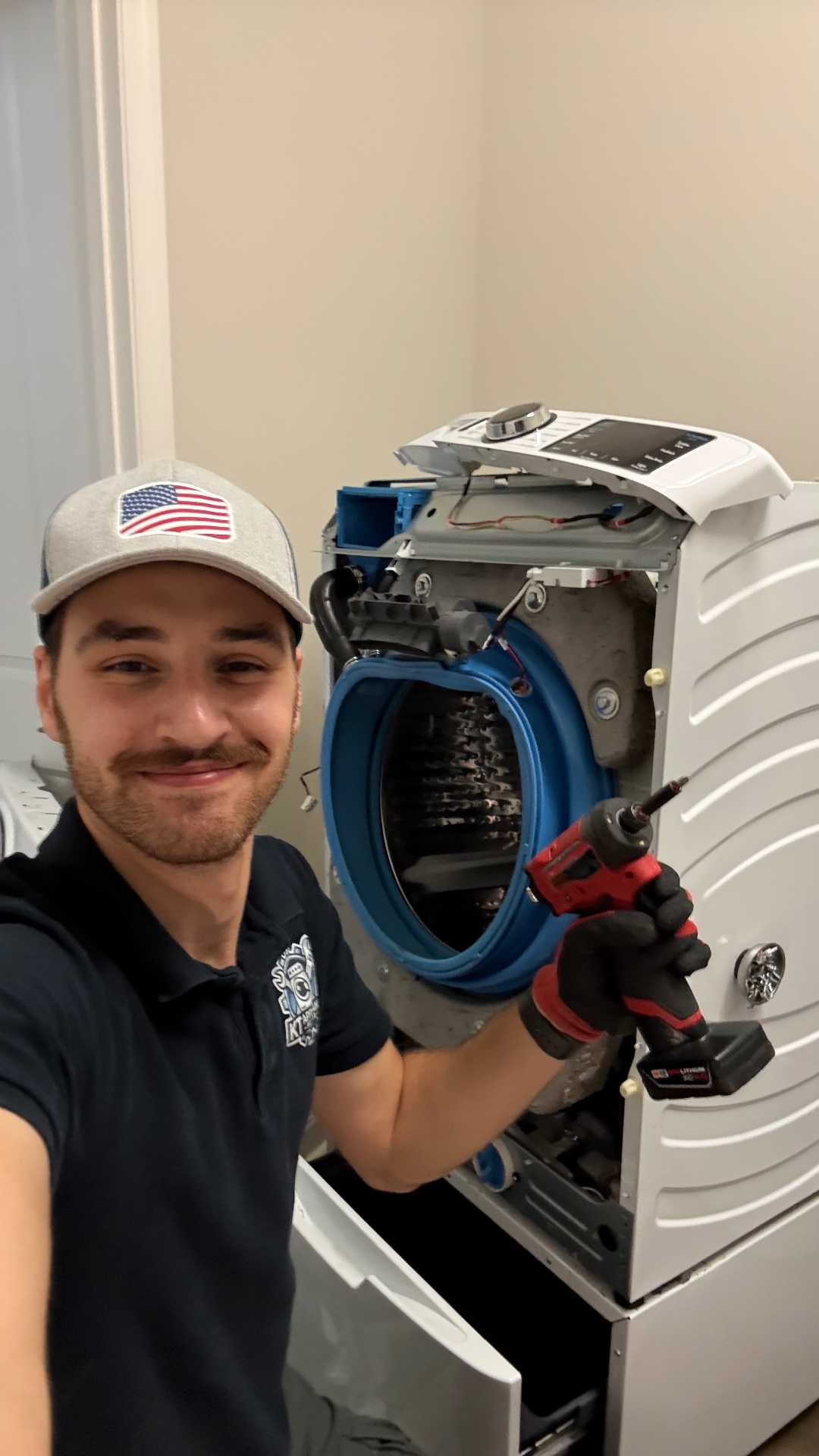 A power tool in use beside a washing machine